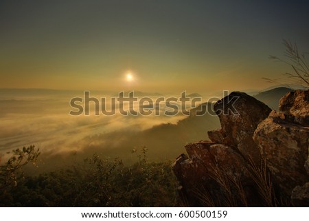 cliff with big rock and sea of cloud over Mekong River at Nongkhai province of Thailand  