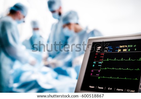 Monitoring of ECG and saturation O2 in the patient in the operating room. Royalty-Free Stock Photo #600518867