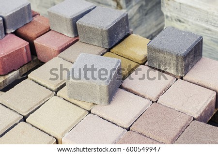 Small concrete blocks in different colors for floor