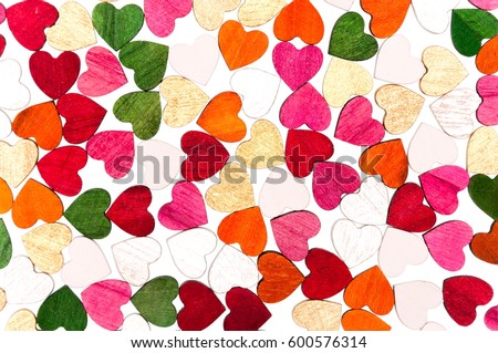 Valentine's Day pattern decorative colorful wooden hearts isolated on white background. Festive Valentines background. 