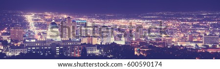 Vintage toned Salt Lake City downtown night panorama, Utah, USA. 
