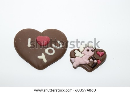 Chocolate heart with text I love you and chocolate heart with image of angel