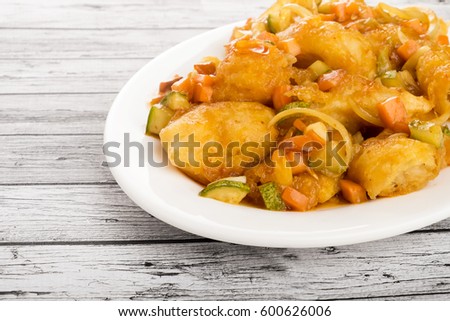 Fried Fish Fillet with Sweet and Sour Sauce, selective focus.