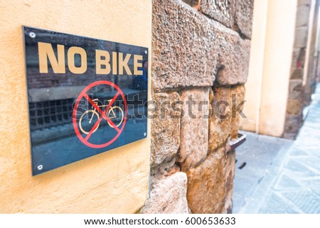 No bike sign along city street.