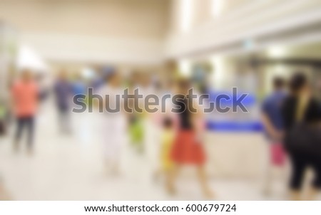 blurred image people in shopping mall with bokeh