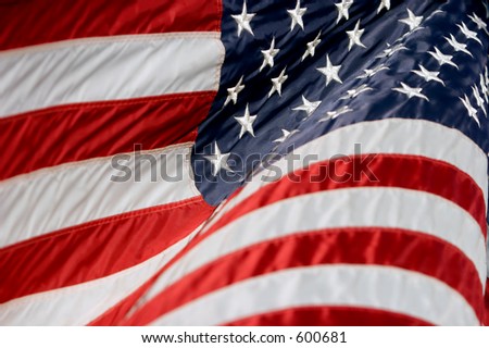 American flag rippling in a breeze (shallow focus).