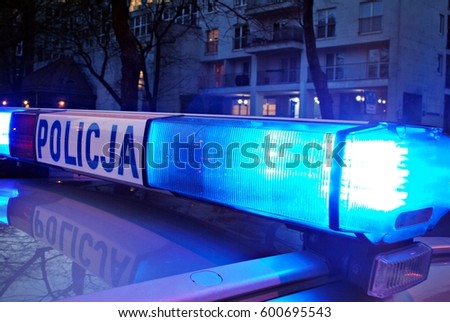 Blue flashing sirens of police car during the roadblock in the city