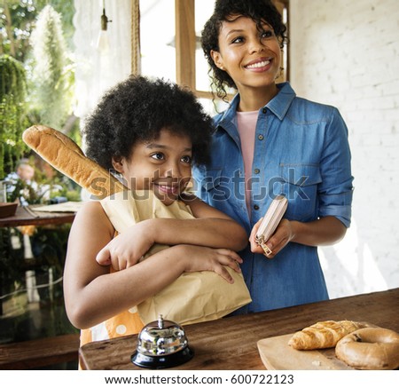 Customer buying bread at bake shop