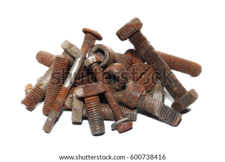 Pile of old rusty screw heads, bolts, metal nuts, isolated on white background Royalty-Free Stock Photo #600738416