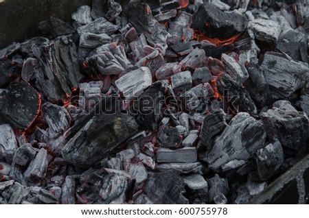 Smouldering coals. Ashes in the barbecue. Royalty-Free Stock Photo #600755978