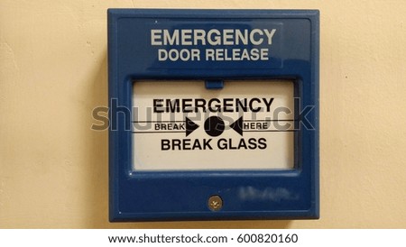 Emergency door release . blur image , low light, selective focus