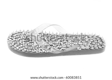 Uncomfortable footwear with thumbtack on insole. fake Royalty-Free Stock Photo #60083851