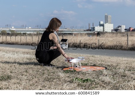 Drone set by a woman in black clothes
