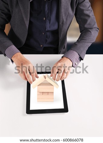 hands holding and pointing contemporary digital tablet

