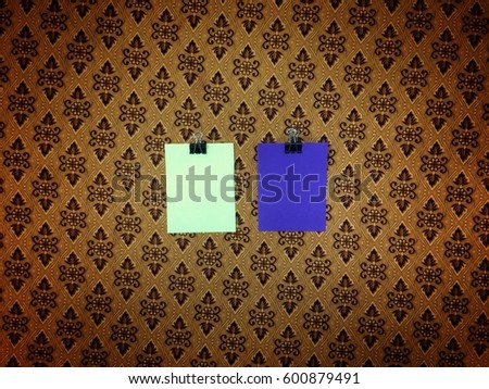 "Yellow and purple sticker note with floral patterns background"