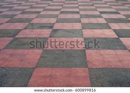 Old Tiled Red Brick outdoors, mosaic path,  Block pavement floor texture close up, background.