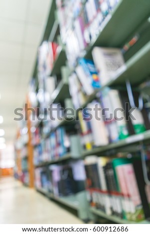 Blurred Books are on Bookshelf  in library of school.