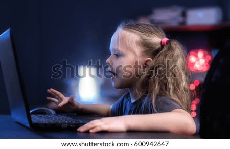 little girl communicates through the internet