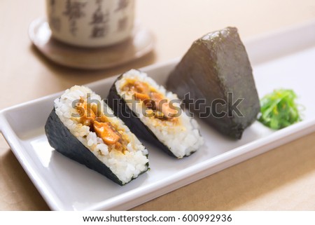 Salmon Onigiri, rice ball wrapped with seaweed, Japanese food Selective Focus Royalty-Free Stock Photo #600992936