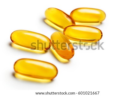 Capsules Omega 3 isolated on white background. Close up, top view, high resolution product. Health care concept.