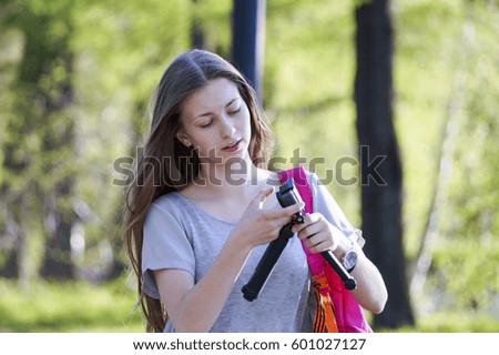 teen in the Park taking pictures on camera