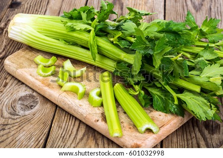 Bunch of fresh celery stalk with leaves. Studio Photo Royalty-Free Stock Photo #601032998