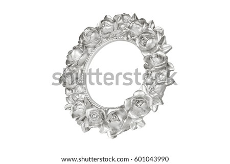 Silver oval picture frame with rose decor, clipping path included.