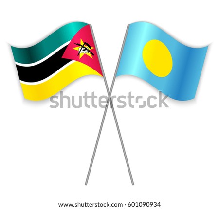Mozambican and Palauan crossed flags. Mozambique combined with Palau isolated on white. Language learning, international business or travel concept.