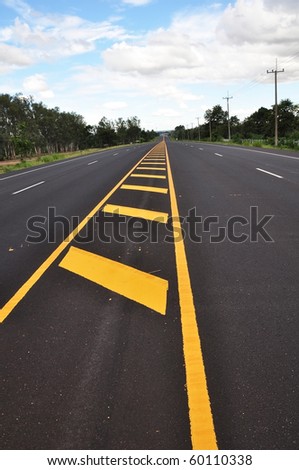 Yellow line traffic sign on the road surface