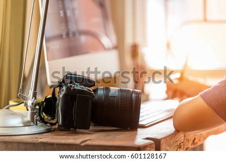 Asia photographer working on computer