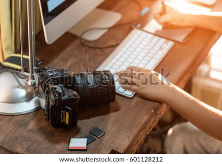 Asia photographer working on computer