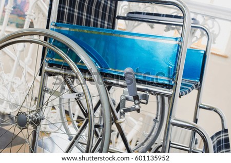 Empty wheelchair parked in hospital