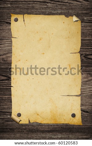 Old grungy paper sign on wooden wall.