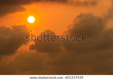 The sun with clouds, Orange light rays on sky at dawn or evening time