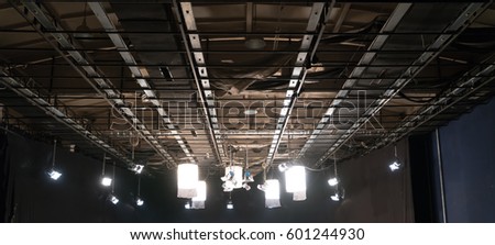 Lighting equipment on the ceiling in television studio Royalty-Free Stock Photo #601244930