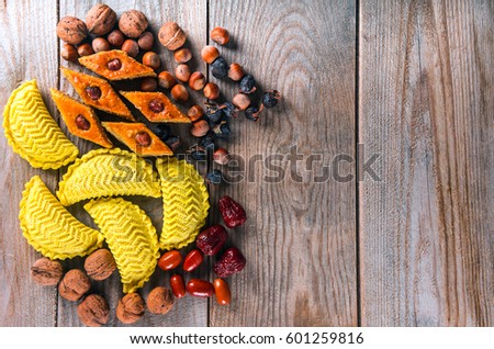 Oriental sweets to Novruz holiday on wooden background