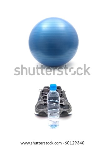 Joggers, water and a fitball isolated against a white background