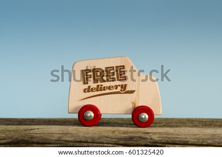Free delivery van, handmade wooden toy truck Royalty-Free Stock Photo #601325420