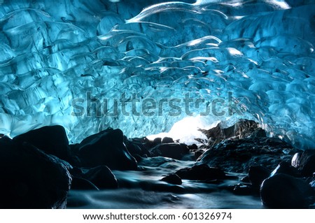 Entrance of an ice cave inside Vatnajokull glacier in southern Iceland.  Royalty-Free Stock Photo #601326974
