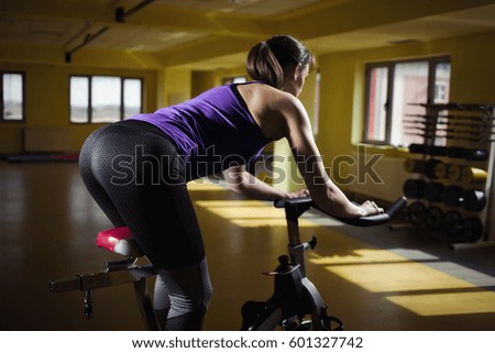 Girl in health club. Attractive Woman In The Fitness Club.