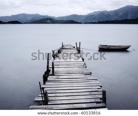 look on pier and boat, low saturation Royalty-Free Stock Photo #60133816