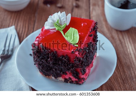 Delicious cake dessert with strawberry cream and chocolate