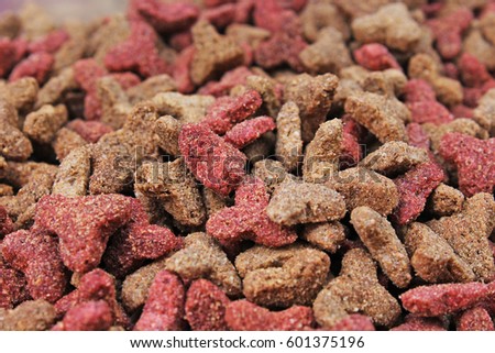 Cat food, granule, as background. Cat food texture pattern. Dry pet food textures studio photo.