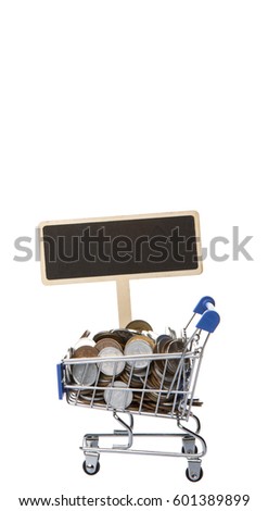 Concept image of retail commerce with miniature shopping cart and mini blackboard with Japanese coins over white background