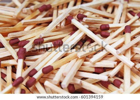 Match sticks with brown heads in a row. Fire Matches texture pattern concept. Stacked matches as background. Combustible inflammable incendiary tindery wooden material.