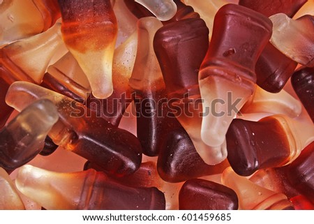 Cola gum candy. Gummy candy cola flavored sweet snack. Cola bottle shaped sweets.