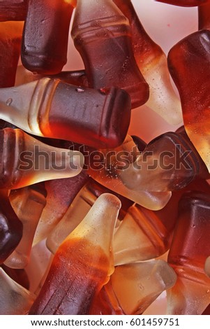 Cola gum candy. Gummy candy cola flavored sweet snack. Cola bottle shaped sweets.