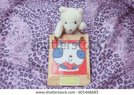 Old bear with photo frame<vintage tone>