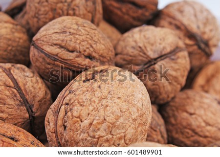 Walnut texture. Brown big walnuts as background. walnut nuts pattern close up photo.
