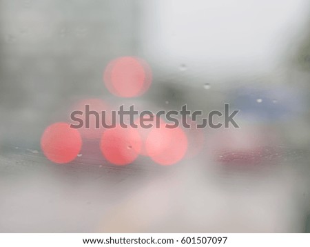 Blur background from the wet car windows in raining day.